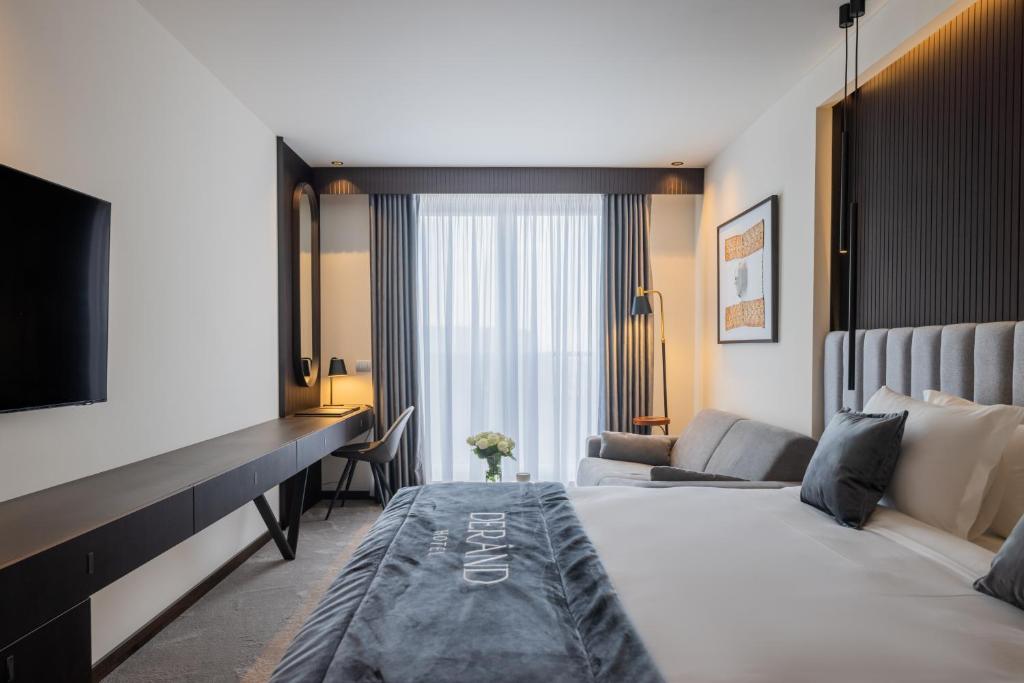 Postel nebo postele na pokoji v ubytování Derand Hotel