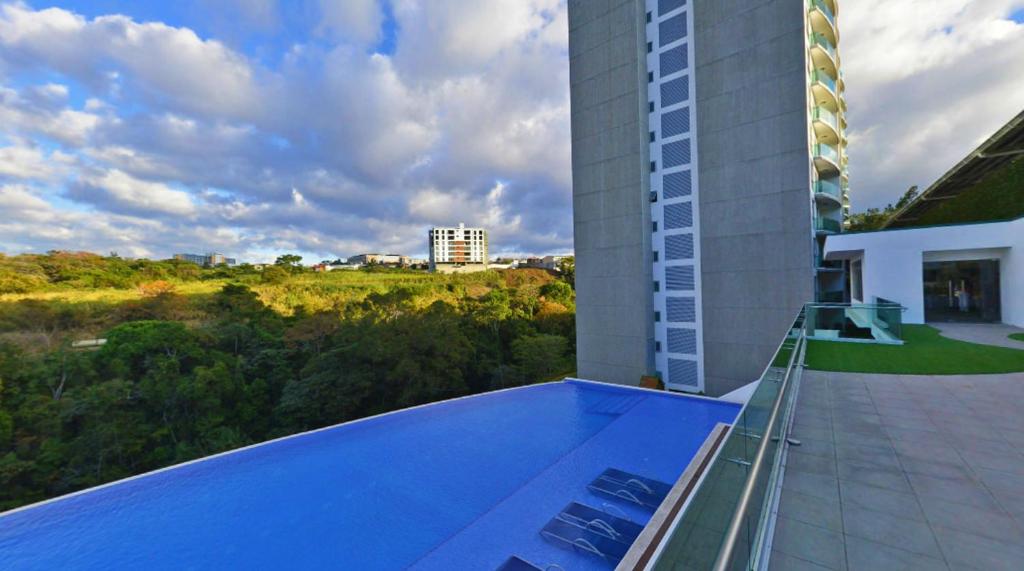 a view from the balcony of a building at Residencial Paradisus in San José