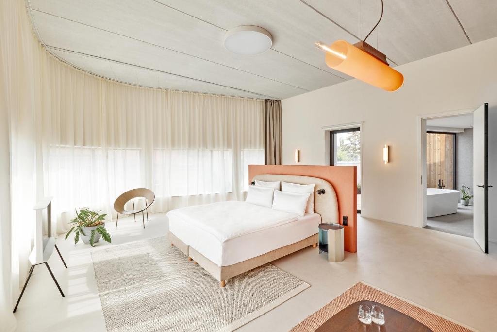 Postel nebo postele na pokoji v ubytování Hotel PERK
