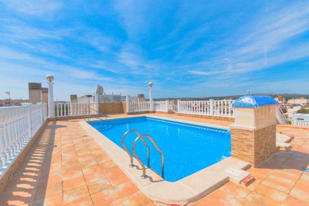 a swimming pool on the roof of a building at 2-Bed Apartment with rooftop pool in Formentera del Segura