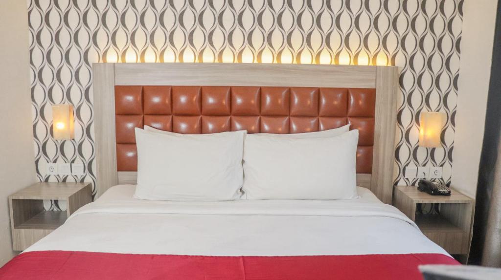 Letto o letti in una camera di Pakons Prime Hotel
