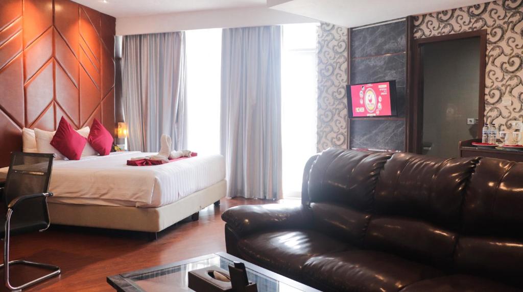 Letto o letti in una camera di Pakons Prime Hotel