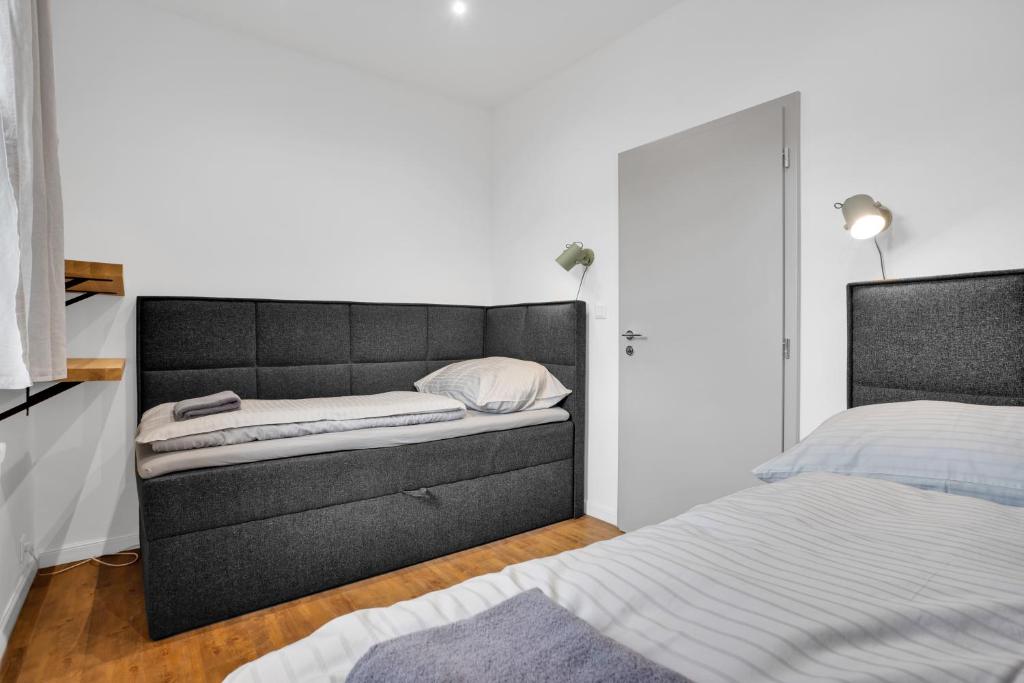 Postel nebo postele na pokoji v ubytování Apartmány Ochsendorf - Pod Strání