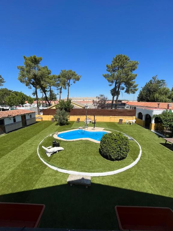 an aerial view of a yard with a swimming pool at Villa Nogueroles in Sanchidrián