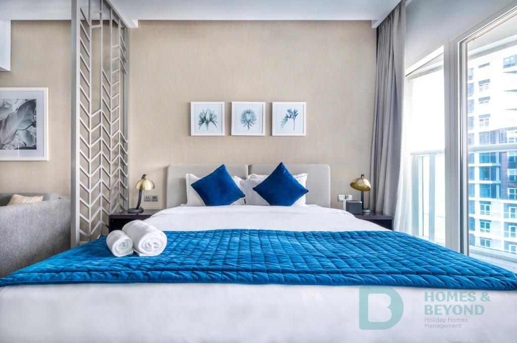 Postel nebo postele na pokoji v ubytování Studio Apartment in Businessbay - Dubai Canal View