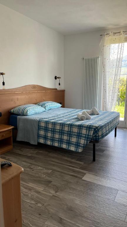 A bed or beds in a room at Agritur Lavanda