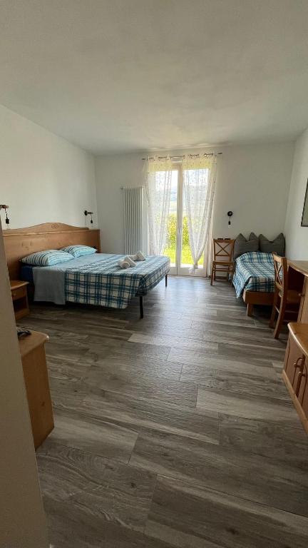 A bed or beds in a room at Agritur Lavanda
