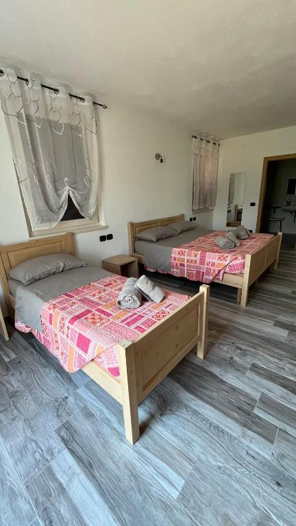 A bed or beds in a room at Agritur Lavanda