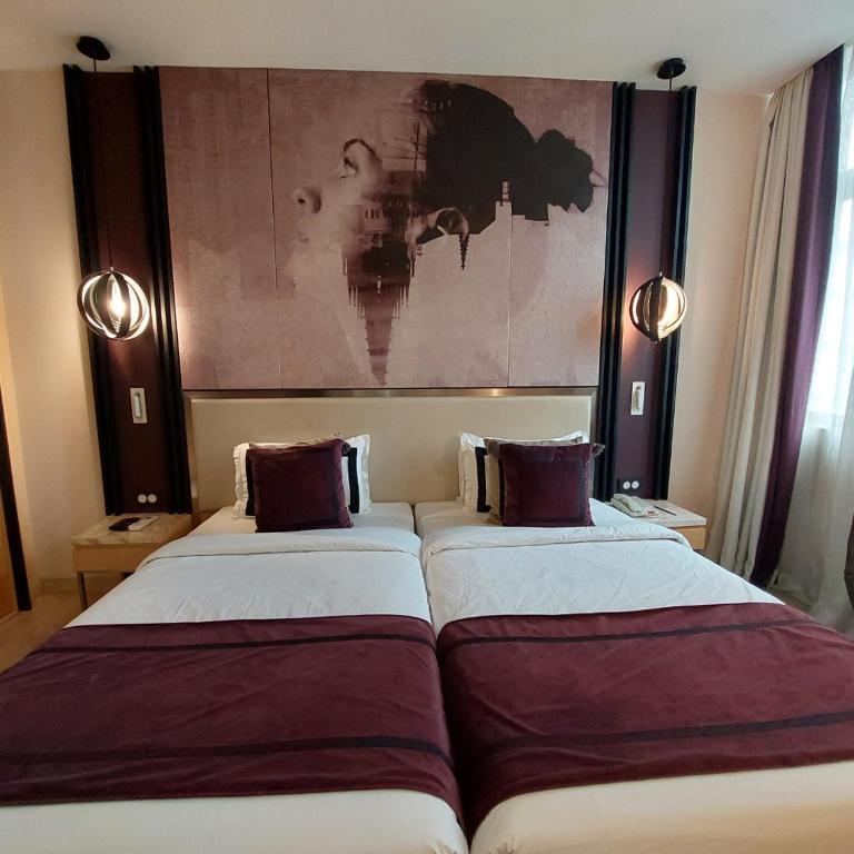 Postel nebo postele na pokoji v ubytování BEYZAA HOTEL AND SUITES