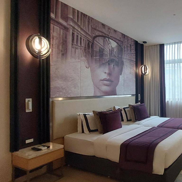 Postel nebo postele na pokoji v ubytování BEYZAA HOTEL AND SUITES