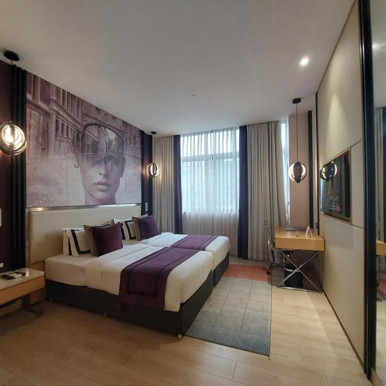 Postel nebo postele na pokoji v ubytování BEYZAA HOTEL AND SUITES