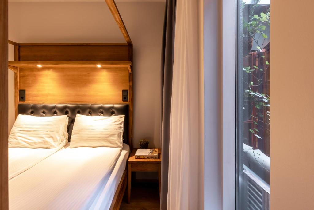 Postel nebo postele na pokoji v ubytování Hotel Von