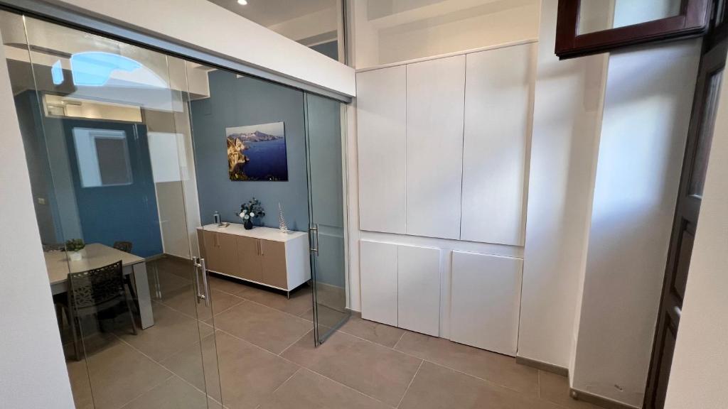 a bathroom with white cabinets and a sink at Case vacanze Cappero e Malvasia in Canneto