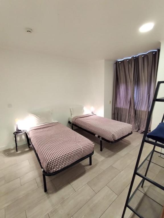 Postel nebo postele na pokoji v ubytování Figueira House in Beira Minho