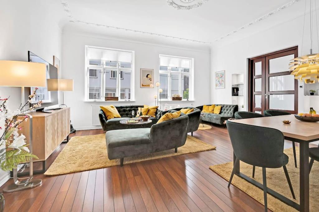 a living room with a couch and a table at The Modern Breakaway in Aarhus in Aarhus