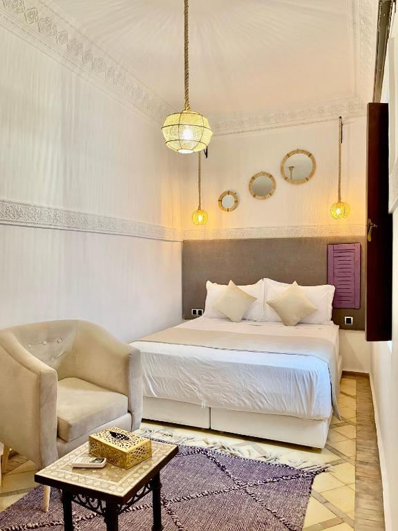 Postel nebo postele na pokoji v ubytování Riad Al Wafaa