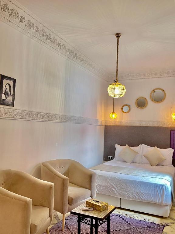 Postel nebo postele na pokoji v ubytování Riad Al Wafaa