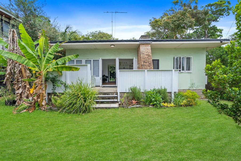 a house with a green lawn in front of it at Frogmouth - 87 Mooloomba Road in Point Lookout