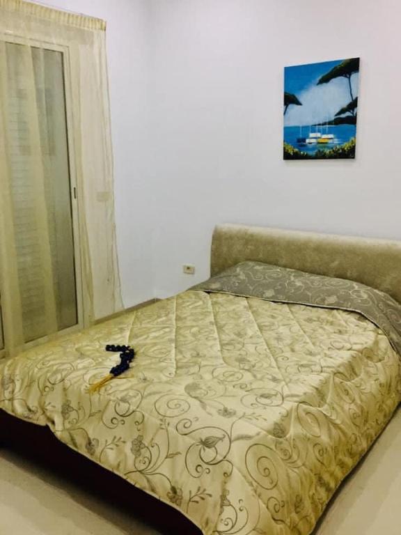 Postel nebo postele na pokoji v ubytování maison d'hôte familiale للعائلات فقط
