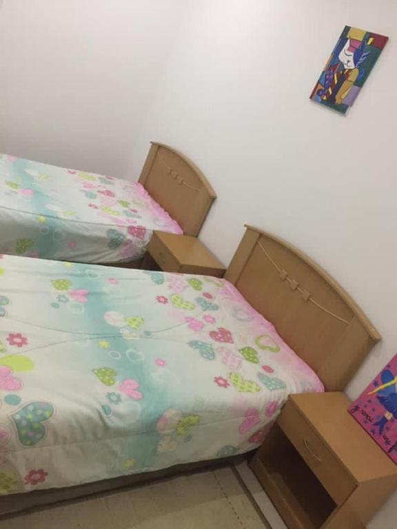 Postel nebo postele na pokoji v ubytování maison d'hôte familiale للعائلات فقط