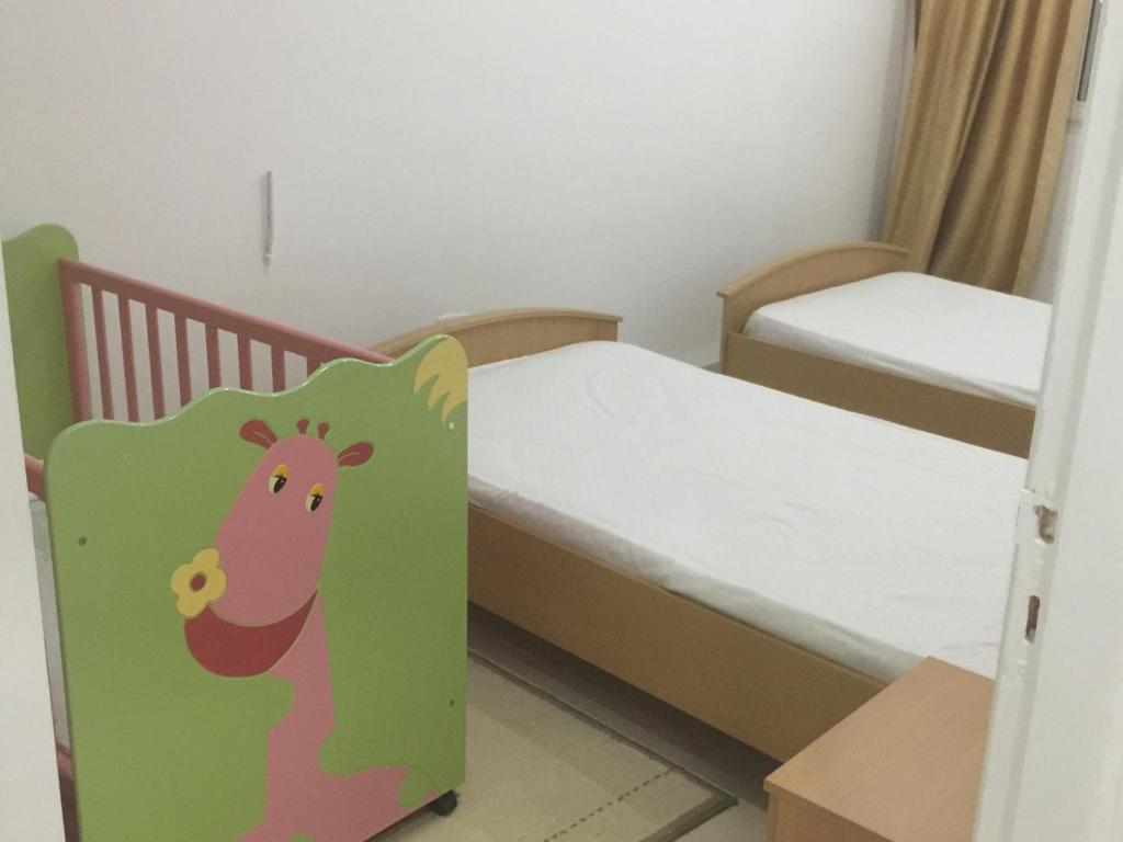 Postel nebo postele na pokoji v ubytování maison d'hôte familiale للعائلات فقط