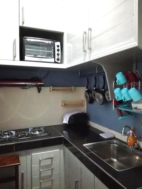 Kuchyň nebo kuchyňský kout v ubytování Homestay Tawau