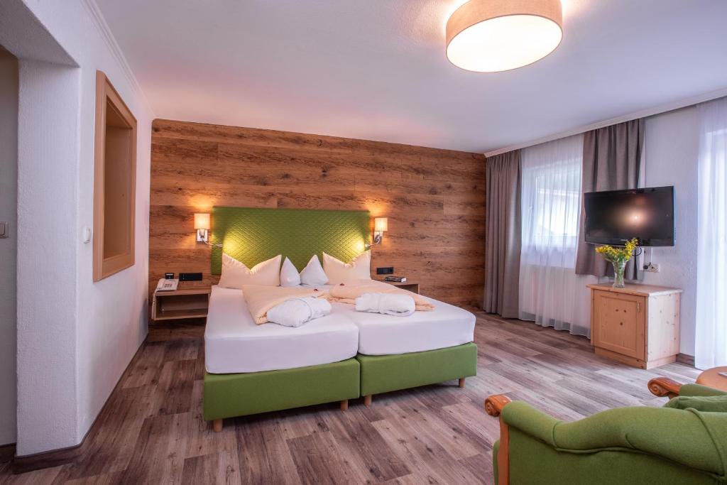 Postel nebo postele na pokoji v ubytování Hotel Glockenstuhl
