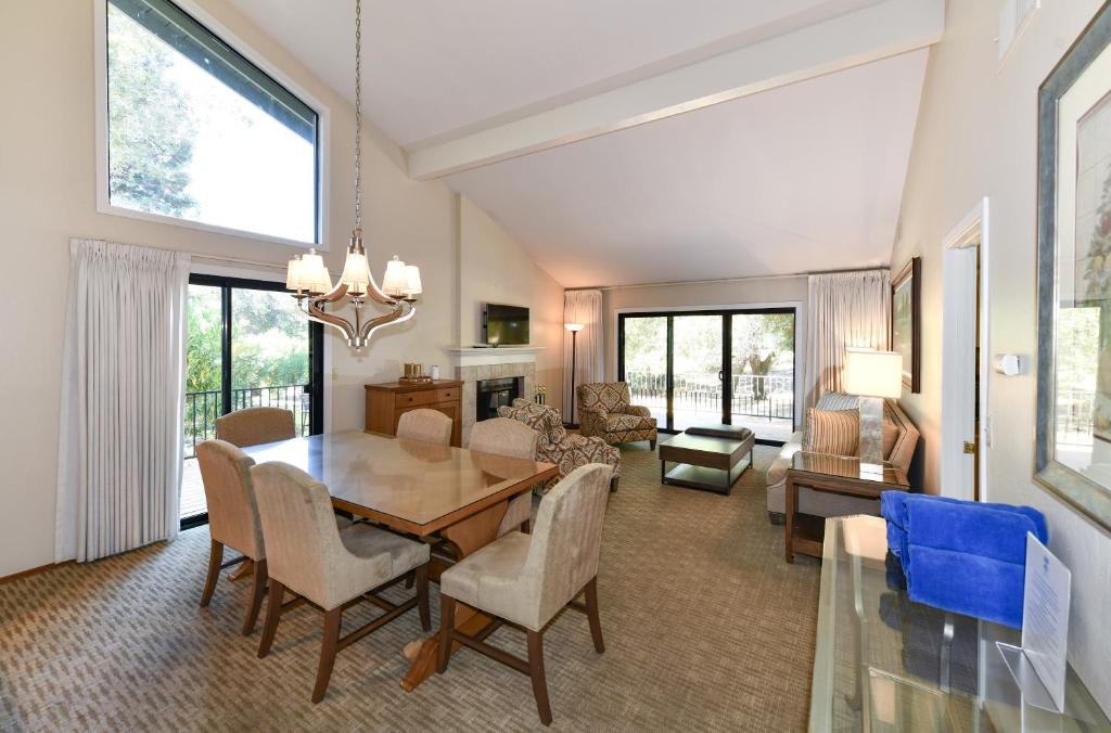 a dining room with a table and chairs and a living room at 808 Augusta Cir home in Napa