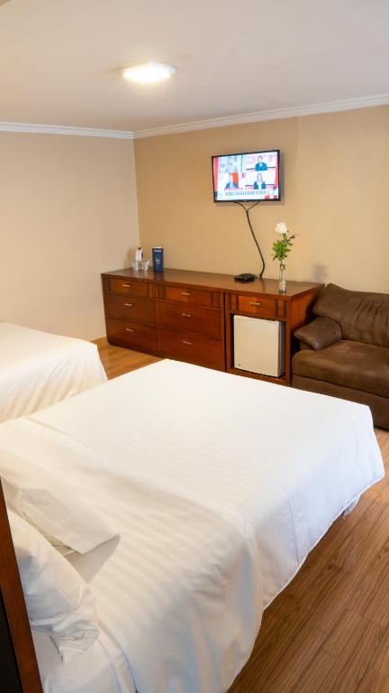 Postel nebo postele na pokoji v ubytování Fenix Hotel