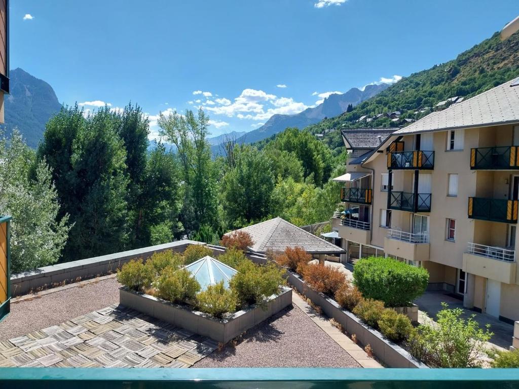 a view from the balcony of a apartment building with a garden at Briançon GRANDE TORINO SKYWAY in Briançon
