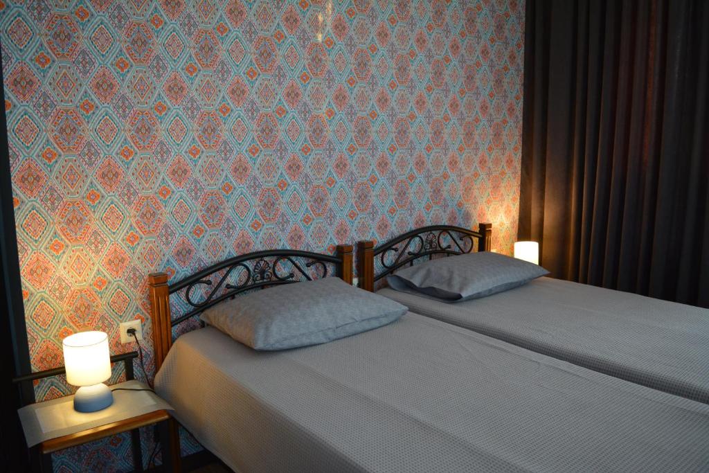 Postel nebo postele na pokoji v ubytování Velio Guest House