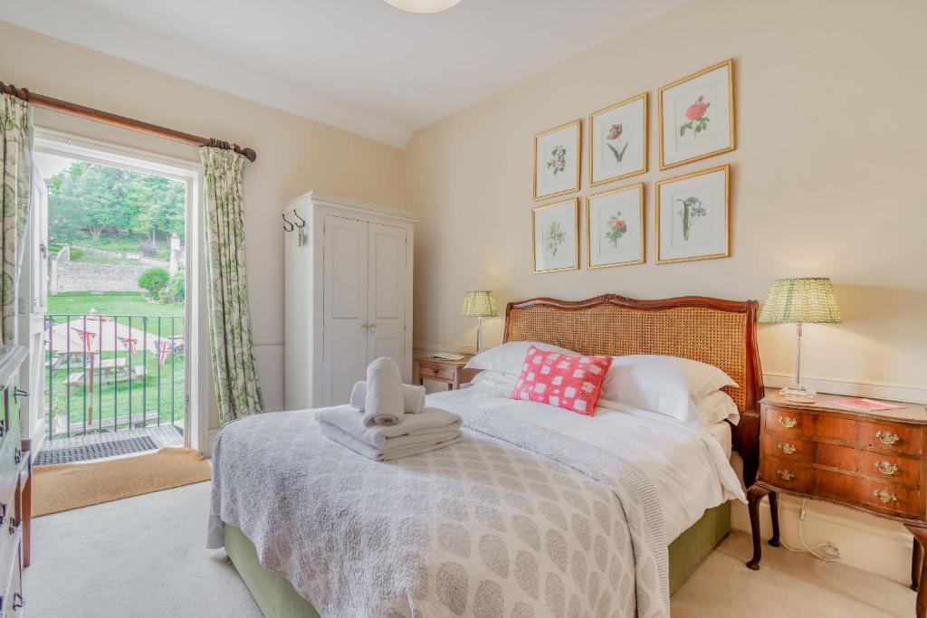 a bedroom with a bed and a large window at Tiger Inn - Grace in Eastbourne