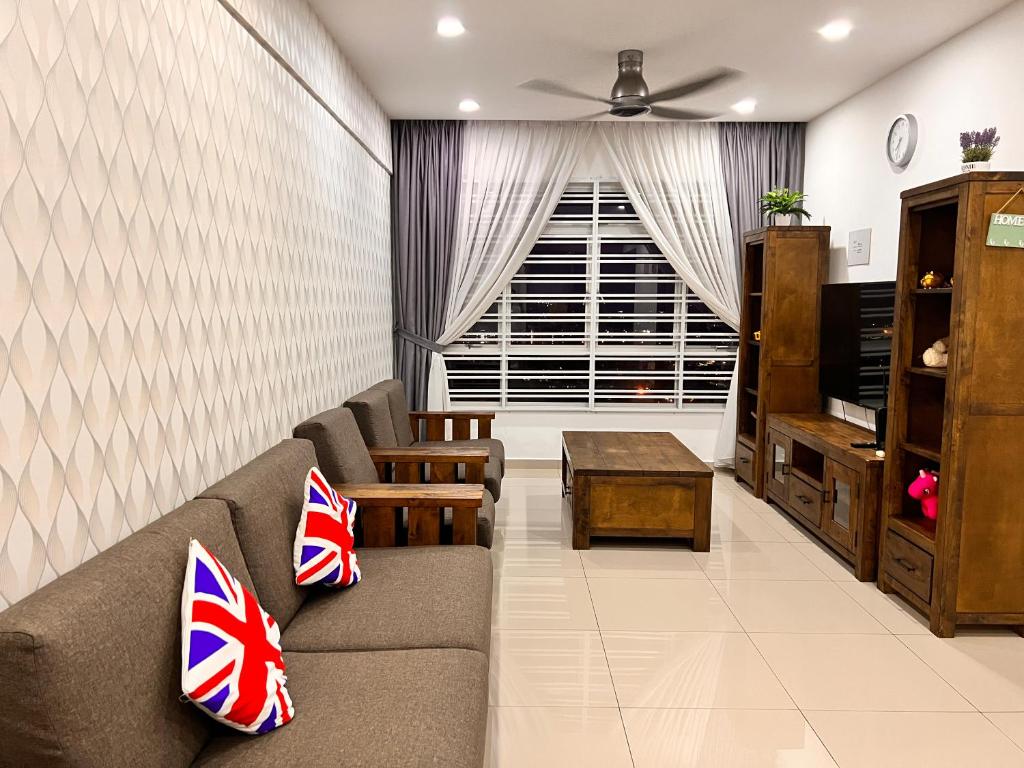 a living room with a couch and a window at PANGSAPURI MIDAS in Johor Bahru
