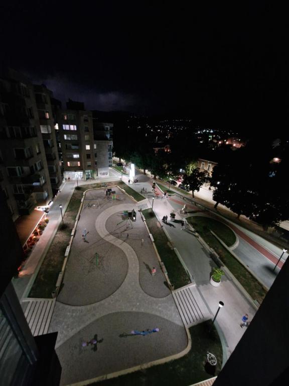a night view of a street with a park at Bugojno Stan in Bugojno