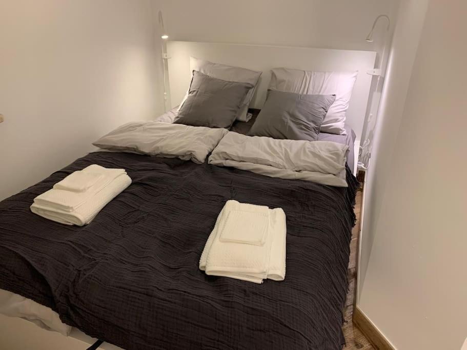 A bed or beds in a room at Close Wola Apartment