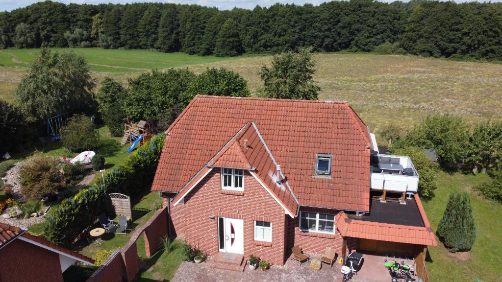 an aerial view of a house with a roof at Ferienwohnungen am Krakower See in Serrahn