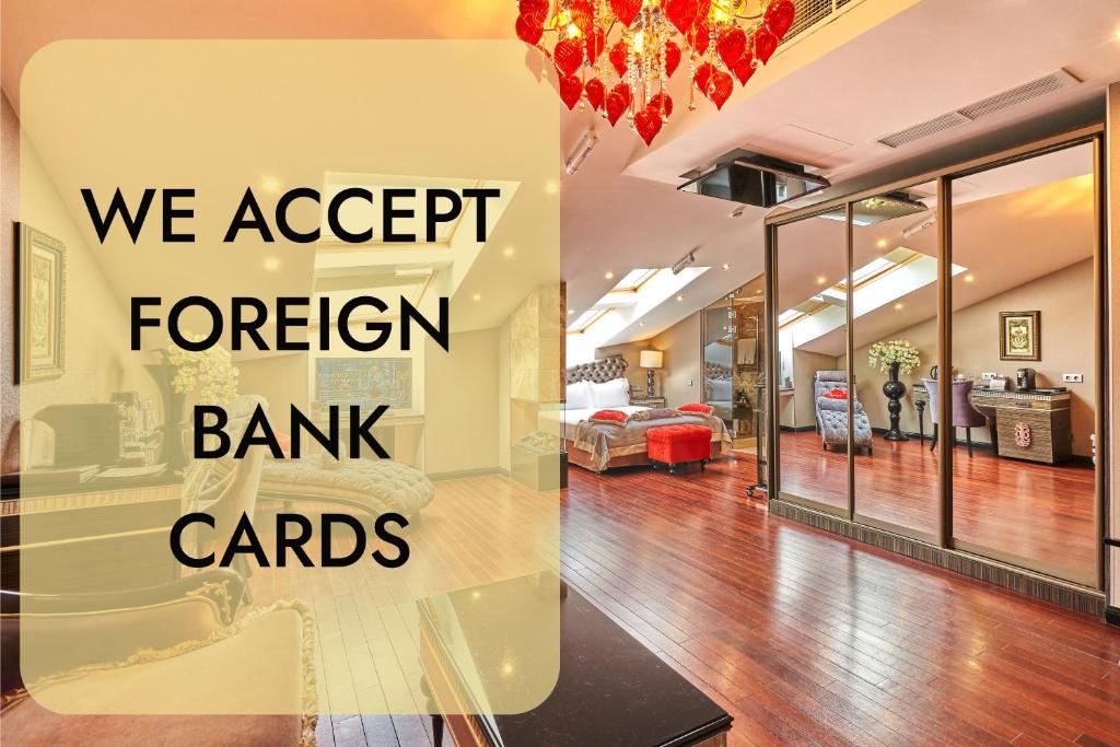 a living room with a couch and a room with a dining room at Majestic Boutique Hotel Deluxe in Saint Petersburg