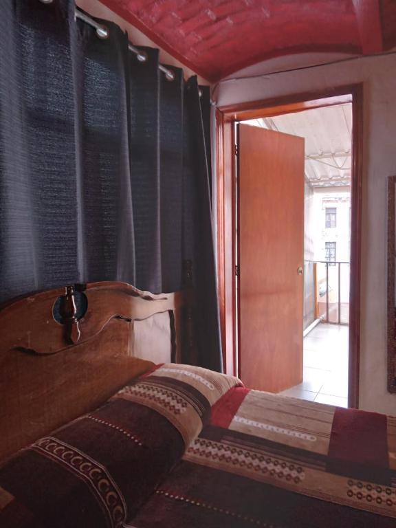 Postel nebo postele na pokoji v ubytování El Hogar de Carmelita