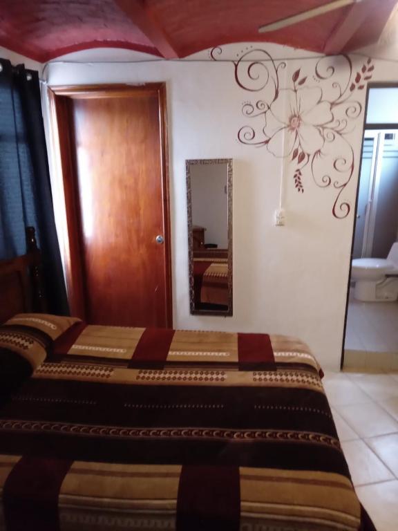 Postel nebo postele na pokoji v ubytování El Hogar de Carmelita