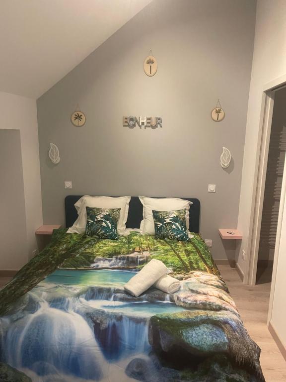 En eller flere senge i et værelse på L'Atypique ,maison individuelle Wifi et Netflix gratuit