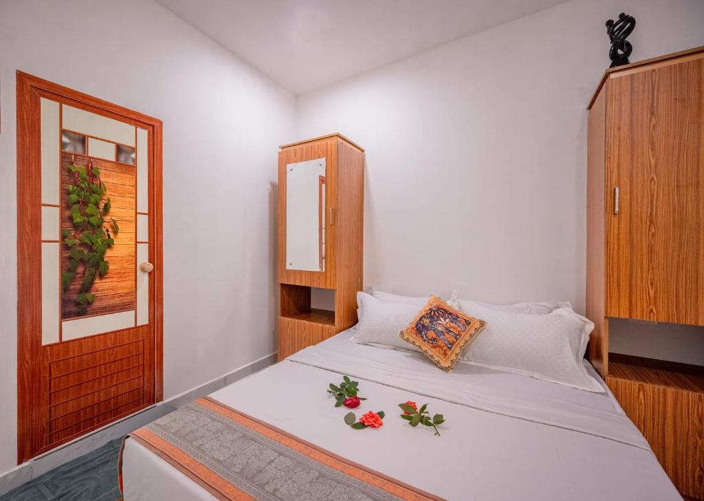 Una cama o camas en una habitación de Koinadu Hills