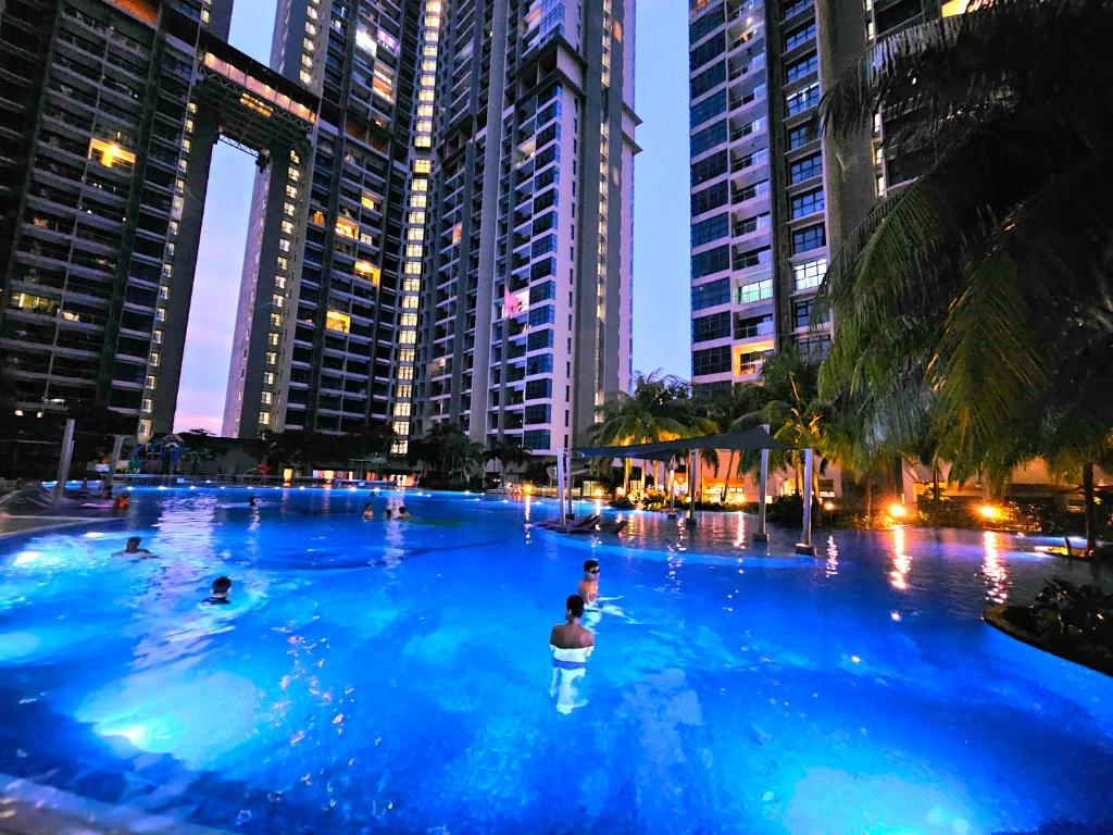 a swimming pool in a city with people in it at Atlantis Residence Melaka By GGM in Melaka
