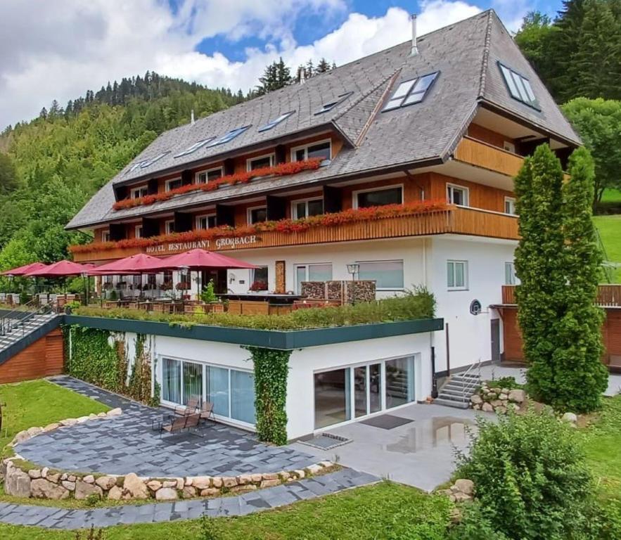 an image of a large house at Hotel Großbach in Menzenschwand