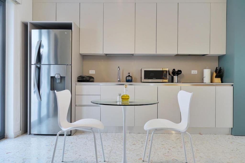Kuchyň nebo kuchyňský kout v ubytování La Moderna by Wynwood House