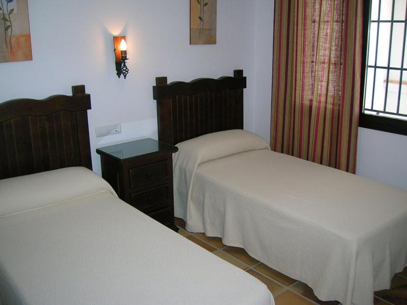 Postel nebo postele na pokoji v ubytování Las casitas de zahora - casitasmanoli