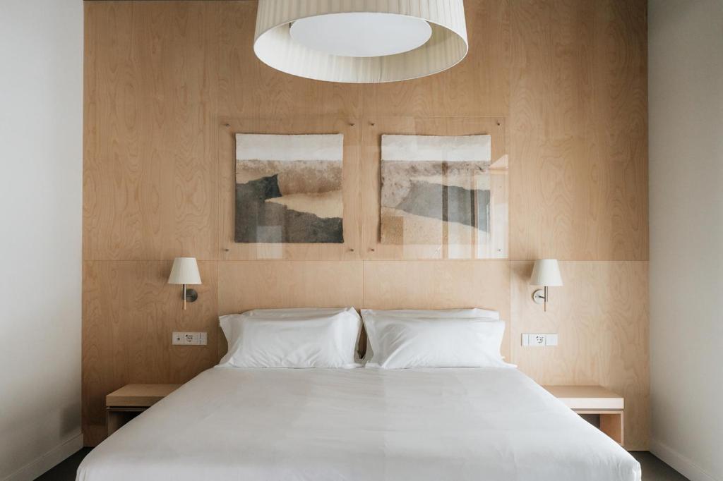 Postel nebo postele na pokoji v ubytování Hotel Santa Ana Tudela