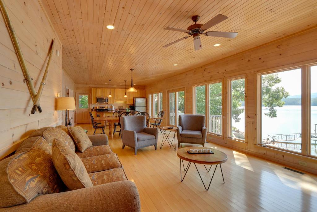 a living room with a couch and a table at Mountain View Cabin on Lake Blue Ridge Hot Tub! in Morganton
