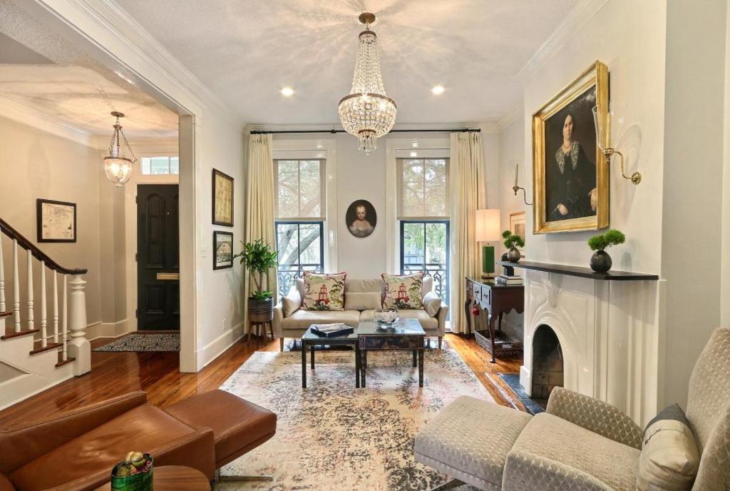a living room with a couch and a fireplace at Isaac LaRoche Estate in Savannah