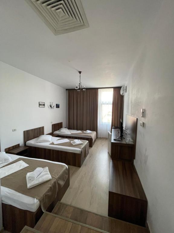 Postel nebo postele na pokoji v ubytování Hotel Prestige