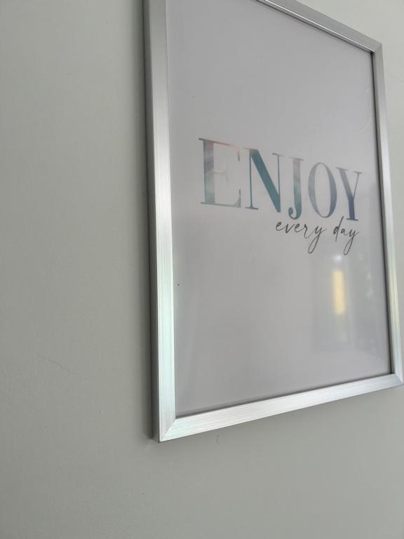 a picture on a wall with the words enjoy every try at Cozy home&amp;garden (Paris&#47;Disney) in Noisy-le-Sec